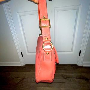 Coral and gold coach shoulder bag. Beautiful gold hardware.